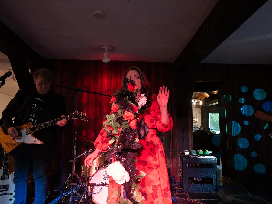 A guitarist and singer performing together on the mill's gallery stage